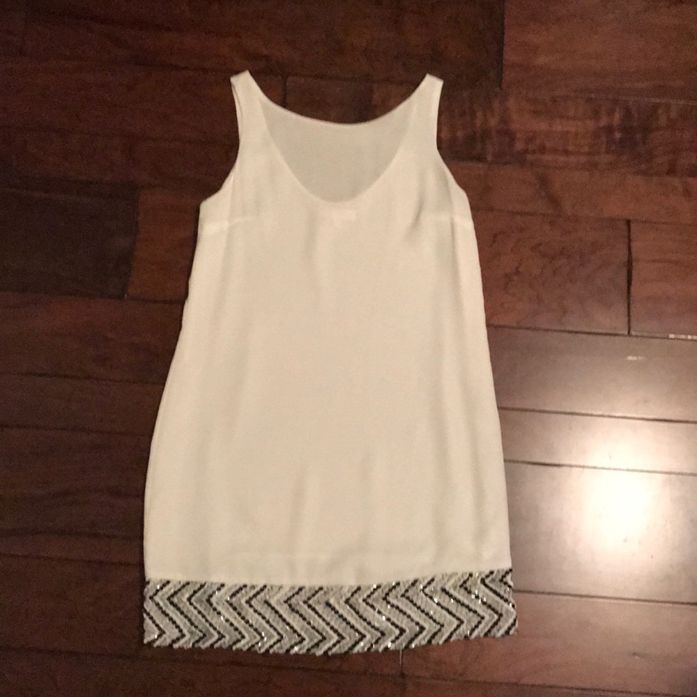 White flowy dress with sequin detail